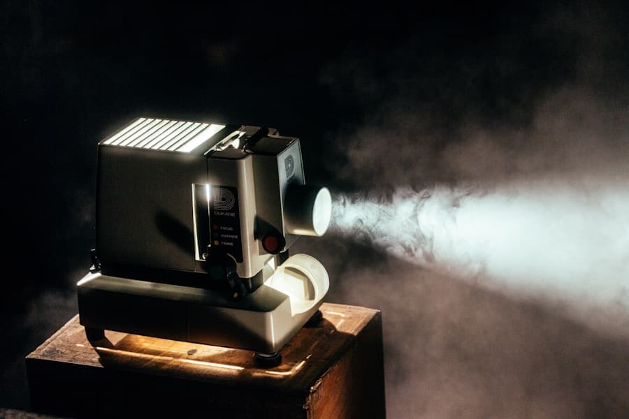 A film projector casting light in a cinema